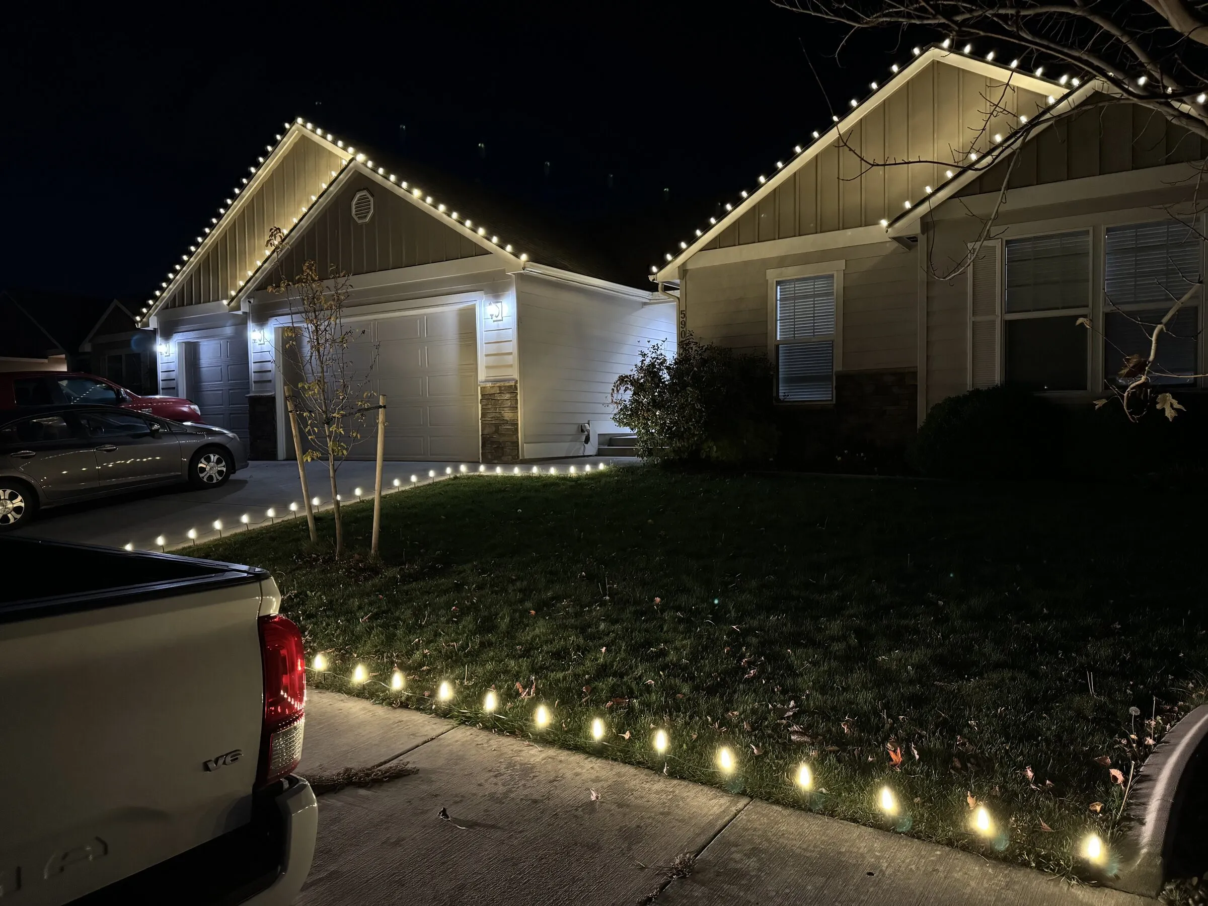 Roofline and walkway Christmas lights on a Tri-Cities home